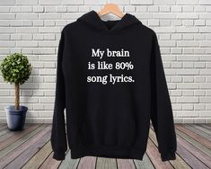 "My Brain Is Like 80% Song Lyrics Sweatshirt, Funny Music Shirt, Music Lover Hoodie, Lyrcis Tee, Song Shirt, Sarcastic Shirt, Funny Sweater Welcome to my BEB Tee Design store! In my shop, you will find high quality Bella Canvas Brand T-Shirt. My shirts are soft and regular relax fit. Hey! Don't forget to see the drop-down menus for the sizes and colors that you would like to order. And it is so important to check the size charts in the listings. These are the information below about my products Hip Hop Cotton Hoodie For Concert, Fitted Cotton Hoodie With Graphic Print, Funny Cotton Hoodie Sweatshirt, Cotton Hip Hop Hoodie For Concerts, Fitted Cotton Hoodie With Letter Print, Band Merch Hooded Cotton T-shirt, Hip Hop Hooded Cotton T-shirt, Hip Hop Cotton Hooded T-shirt, Cotton Hip Hop Hooded T-shirt