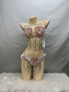 a mannequin wearing a bra with chains and hearts on it