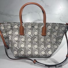 Tory Burch Canvas Basketweave New Ivory Basketweave Tote Crossbody Bag Nwt Msrp $350 Brand New Never Worn With Out Original Price Tags- They Fell Off And Store Had To Make A New Add A Vintage Touch To Your Look Accessorizing With The Statement Tory Burch Canvas Basket Weave Small Tote Bag. Sku: #9842457 Cotton Material Construction. Zipper Closure. Two Top Handles For Hand Carry; Single Shoulder Carry Handle. Signature Double T Accent Motif. Intricate Design Allover. Imported. Measurements: Heig White Intrecciato Weave Bag For Daily Use, White Bags With Intrecciato Weave And Double Handle, White Shoulder Bag With Double Handle And Intrecciato Weave, White Double Handle Bags With Intrecciato Weave, White Double Handle Bag With Intrecciato Weave, White Shoulder Bag With Intrecciato Weave For Everyday, White Intrecciato Weave Bag For Everyday Use, White Intrecciato Weave Shoulder Bag For Everyday Use, White Rectangular Bag With Intrecciato Weave