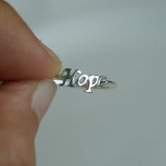 Hope ring is made from 925 Sterling silver. Wear it alone or stack it with other words and symbols This ring is handmade and hand cast, each one is a little bit one of a kind and will never be 100% exact. Gift box included. For more information please read our policies. Thank you so much visiting and hope you enjoy shopping with us!! Pitchanan Nickel Free Symbolic Stackable Rings As Gift, Meaningful Silver Stackable Rings Gift, Silver Stackable Rings For Gift, Meaningful Style, Meaningful Silver Stackable Rings, Meaningful Silver Ring As Gift, Meaningful Silver Rings As Gifts, Inspirational Personalized Sterling Silver Rings, Symbolic Nickel-free Engraved Ring Gift, Symbolic Engraved Nickel-free Ring As Gift