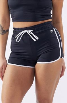 You will move with ease from land to sea in these stretch-enhanced swim shorts topped with a high waist. 3 1/2" inseam   Lined   80% recycled polyester; 20% spandex   Hand wash, line dry   Imported Sporty Black Swimwear With Built-in Shorts, Moisture-wicking High-waisted Shorts For Beach, Sportswear Swimwear With Built-in Shorts And Stretch, High-waisted Athletic Shorts With Built-in Shorts For Beach, High-waisted Sports Shorts For Beach Season, Summer Style Short Length Activewear For Swimming, Beachwear Swimwear For Workout In Short Length, Sporty Swim Trunks With Built-in Shorts, Short Swimwear For Workout During Beach Season