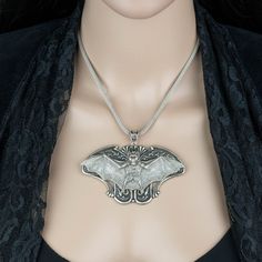 "Make a statement with this vintage style necklace! It would make a great addition to any Gothic jewelry collection. It would also make a fabulous gift for any bat lover! 💀 DESCRIPTION: Each pendant necklace features a highly detailed bat stamping that was hand set onto a large Art Nouveau stamping. The metal mesh chain was finished with a lobster clasp and an extender. Choose the color you would like from the drop down menu. 💀 COLORS: - Black bat - Silver bat 💀 SIZE & MATERIALS: The stam Collectible Vampire Jewelry For Halloween, Vintage Costume Necklaces For Halloween, Vintage Halloween Costume Necklaces, Vintage Halloween Pendant Jewelry, Vintage Halloween Costume Jewelry, Bat Pendant, Bat Necklace, Vintage Style Necklace, Jewelry Halloween