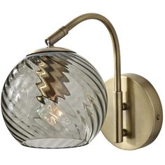 This Wall Lamp from the Camden collection by Adesso will enhance your home with a perfect mix of form and function. The features include a Antique Brass finish applied by experts.   Product Features Include: Brand: Adesso  Collection: Camden  SKU: 3924-21  UPC: 798919392414  Category: Wall Sconce  Finish: Antique Brass  Shade: Smoked Swirled Glass  Length: 12.00  in.  Width: 5.00  in.  Height: 10.00  in.  Backplate/Canopy Width: 0.00  in.  Backplate/Canopy Length: 0.00  in.  Bulbs Included: No Brass Wall Lamp, Vintage Edison Bulbs, Arc Lamp, Wall Fixtures, Brass Wall, Wall Fans, Wall Light Fixtures, Light Sconces, Garden Lamps