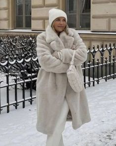 Material: 100% Faux Fur Wrap yourself in elegance with our Long Faux Rabbit Coat. Crafted from high-quality faux fur, this coat mimics the softness and allure of real rabbit fur, providing a luxurious feel. The extended length adds a touch of drama and warmth, making it a chic choice for colder seasons. Whether you're attending a special event or want to elevate your everyday style, the Long Faux Rabbit Coat combines fashion with compassion, ensuring you make a statement with both warmth and gra Cream Faux Fur Coat Outfit, Winter White Long Fur Coat With Faux Fur Trim, Winter White Faux Fur Coat, Chic Winter Faux Fur Coat, Chic Faux Fur Winter Coat, Solid Color Faux Fur Long Coat, Solid Color Long Faux Fur Coat, Chic Winter Fur Coat With Faux Fur Lining, Fluffy Winter White Fur Coat For Winter