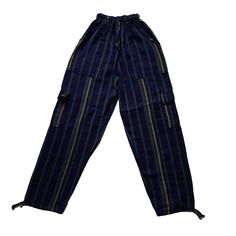 Nice comfy pants for going to the beach, camping, or spending the day at home.These hippie pants have 2 pockets on the front + 2 cargo pockets +1 pocket on the back.They are high-waisted boho pants. They have a drawstring in the waist. It was handmade by Ecuadorian artisans using the foot-treadle loom technique.Materials:75% cotton and 25% acrylic Measurements:Waist circumference: stretches from 24" up to 34"Hip circumference: 42"Rise: 11"Inseam: 28"Total Length: 39"Thigh: 12"Leg opening: 8" Car Indigo Bohemian Relaxed Fit Bottoms, Blue Cargo Pants With Hip Pockets For Summer, Blue Summer Cargo Pants With Hip Pockets, Bohemian Long Pants With Side Pockets, Blue Full-length Cargo Pants With Patch Pockets, Blue Relaxed Fit Hippie Bottoms, Blue Hippie Relaxed Fit Bottoms, Blue Hippie Harem Pants With Pockets, Hippie Blue Bottoms With Pockets