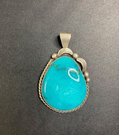 Navajo Jewelry Handcrafted Sterling Silver and Turquoise Pendant by S Cooke This stunning handcrafted turquoise and sterling silver pendant was created by Navajo artist S. Cooke.  No filters, or enhancements, were used during or after photograph.  This particular pendant just happens to be photogenic.  - Gemstone : Turquoise - Metal : 925 Sterling Silver - S Cooke Stamped - Sterling Stamped    - Pendant Length : 2" including bail | Width: 1.25" *Measurements are approximate. **Please note: this listing is for the pendant only. Turquoise and Navajo Pearl necklace sold separately. Southwestern Turquoise Necklace With Large Stone, Southwestern Untreated Turquoise Collectible Necklace, Southwestern Untreated Turquoise Necklace, Untreated Southwestern Turquoise Necklace, Artisan Untreated Turquoise Necklace, Collectible Southwestern Turquoise Pendant Necklace, Southwestern Engraved Turquoise Necklace, Southwestern Turquoise Pendant Necklace, Untreated Southwestern Turquoise Pendant Necklace