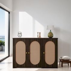 the sideboard is made out of wood and rattan