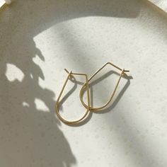 These 14k gold hoops are perfect for everyday wear. Named after the Greek goddess of wisdom and strength, these earrings will elevate your look each time you reach for them. Each purchase comes with an elegant, vegan leather box for storing + caring for your jewelry. DETAILS14k Solid Gold | 1 1/8" in length, 5/8" wide Minimalist Teardrop Gold Plated Hoop Earrings, Minimalist Yellow Gold Teardrop Huggie Earrings, Everyday 14k Gold Teardrop Huggie Earrings, Yellow Gold Teardrop Hoop Earrings For Everyday, Minimalist 14k Gold Teardrop Huggie Earrings, Gold Teardrop Hoop Earrings Minimalist Style, Everyday Yellow Gold Teardrop Hoop Earrings, Minimalist Gold Teardrop Hoop Earrings, 14k Gold Filled Yellow Gold Threader Earrings For Everyday