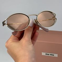 Miu Miu Mu52ys Zvn20f Brand New Sunglasses Pale Gold Pink Gold Mirror Silver Oval Unisex Same/Next Day Shipping! Brand New And 100% Authentic! Made In Italy. Brand: Miu Miu Model Number: Mu52ys / Mu 52ys Color Code: Zvn20f Gender: Women / Unisex Frame Shape: Oval Frame Color: Pale Gold Frame Material: Metal Frame Type: Full Rim Lens Color: Pink Gold Mirror Silver Lens Material: Polyamide Size: 54x21x125 100% Uv Protection! Full Retail Miu Miu Set Includes: 1. Glasses 2. Case 3. Cleaning Cloth Wi Luxury Oval Sunglasses With Tinted Lenses, Miu Miu Gold Sunglasses With Tinted Lenses, Luxury Oval Sunglasses With Mirrored Lenses, Miu Miu Gold Tinted Sunglasses, Luxury Oval Sunglasses With Gradient Lenses, Miu Miu Set, Miu Miu Accessories, Miu Miu Sunglasses, Sunglasses Pink