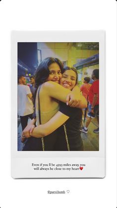 two women hugging each other in front of a white frame with the words love is all you