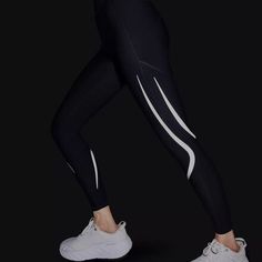 Light up the night in the Sweaty Betty Zero Gravity 7/8 Illuminate Run Legging. These compressive workout tights feature ultra-reflective details that keep us visible on dark or dreary runs, and they offer additional compression similar to kinesiology tape for maximum support. Speaking of support, these leggings feature Sweaty Betty's sculpting shape. Breathable Athleisure Tights For Training, Dynamic Breathable Activewear For Running, High Stretch Light Support Tights For Sports, Functional Activewear With Reflective Details And Micro-elastic Fit, Functional Activewear With Reflective Details, Dynamic Black Activewear For Gym, Sportswear Compression Tights With Light Support, Compression Sportswear Tights With Light Support, Breathable Compression Running Leggings