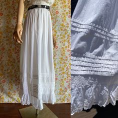 Antique skirt with adorable details: stitched stripes and eyelet ruffle. All cotton. Gathered on the waist, maxi length. The closure on the waist belt is missing. The waist size is tiny, but it's possible to attach laces and wear it with open closure (like shown on mannequin). DETAILS: Brand: no label Composition: no label, 100% Cotton Lining: none Size: no label, the waist is tiny (see measurements, dress form is US 4) Very good vintage condition MEASUREMENTS: Waist: 22.25''/56.5 cm Hips: free Waist-length Bottoms For Summer Daywear, Waist-length Summer Skirt For Daywear, Summer Daywear Waist-length Skirt, Gathered Maxi Skirt For Daywear, Waist-length Skirt For Summer Daywear, Vintage Fitted Ruffled Skirt Bottoms, Fitted Vintage Ruffled Skirt Bottoms, Full-length Ruffled Skirt For Spring, Vintage Fitted Bottoms With Ruffled Skirt