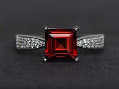 garnet ring square cut wedding engagement ring red gemstone ring silver ring January birthstone ring Garnet Emerald Cut Promise Ring, Emerald Cut Garnet Promise Ring, Square Gemstone Promise Ring, Emerald Cut Garnet Ruby Ring With Accent Stones, Princess Cut Ruby Ring Gift, Red Princess Cut Rings For Gift, Gift Ruby Ring With Princess Cut, Red Ruby Princess Cut Ring For Gift, Red Princess Cut Promise Ring