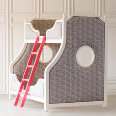 a child's bed with a slide that is attached to the side of it