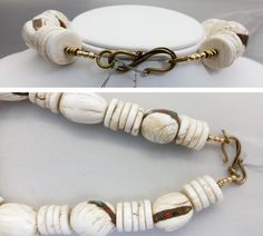 "The gorgeous white beads in this Tibetan necklace are fossilized shells. The pendant and the oval shell beads have been enhanced with inlay called Gak. Gak is a mixture of coral, turquoise, sometimes lapis, brass and sometimes copper. Sacred chank shell (Turbinella Pyrum Linne) has been revered for thousands of years, since at least 2000 B.C. Chank shell is revered in Tibet, India, Nagaland and China. It is used by Hindus and Buddhists in rites and religious ceremonies. Tibetan men and women we White Oval Beads Artisan Jewelry, Artisan White Oval Beads Jewelry, Artisan White Jewelry With Polished Beads, White Jewelry With Natural Oval Stone Beads, White Jewelry With Natural Oval Beads, White Jewelry With Oval Natural Stones, White Artisan Beaded Necklaces With Oval Beads, White Necklaces With Oval Natural Stone Beads, White Necklaces With Oval Natural Stones