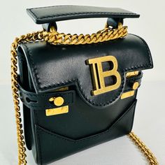 Calfskin B-Buzz Mini Bag -Mini Size -Non-Detachable Chain -Snap Fastening -Gold-Tone Metal Balmain Logo -Gold-Tone Finishes -Protective Pouch Provided -Size: 7 X 12 X 12 Cm / 2.7 X 4.7 X 4.7 In -Strap: 50 Cm / 19.7 In -Main Material: Calfskin -Made In Italy -Item: Yn1da775lprs Balmain Bag, Gold Tone Metal, Mini Bag, Calf Skin, Gold Tones, In Italy, Bag Lady, Pouch, Size 7