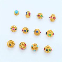 1pc 18K Solid Gold CZ Colorful Gems Oval Bead, Solid Gold Spiral Round Bead, Hollow Bead, Fortune Bead,Tribal Bead,Good Luck Bracelet Spacer material: 18k solid gold, solid gold, gold size:  YJ437 turquoise diameter 5.5mm, thickness 5.5mm, hole 2.5mm YJ438 colorful gems 5.9*7.4mm, hole 1.5mm YJ439 colorful gems diameter 7.5mm, hole 1.3mm YJ441 colorful gems diameter 7mm, hole 1.5mm YJ442 colorful gems diameter 8mm, hole 1.5mm YJ443 colorful gems diameter 8mm, hole 1.5mm YJ444 colorful gems diame Multicolor Round Spacer Beads Jewelry, Gold Rondelle Beaded Bracelets With Colorful Beads, Gold Spiritual Gemstone Beads, Festive Multicolor Spacer Beads, Gold Beaded Bracelets With Gemstone, Gold Jewelry With Colorful Oval Beads, Gold Bohemian Beads For Jewelry Making, Gold Round Beads, Gems, And Cabochons For Gifts, Gold Gemstone Beads And Cabochons As A Gift