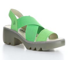 Add carefree style to your steps with these stretchy sandals featuring sturdy rubber soles and an airy open design. From Fly London. Green Slip-on Sandals For Summer, Comfortable Green Non-slip Sandals, Comfortable Non-slip Green Sandals, Spring Green Non-slip Sport Sandals, Green Synthetic Slingback Sandals For Summer, Spring Open Toe Sport Sandals With Rubber Sole, Green Synthetic Slingback Sandals For Spring, Lightweight Sandals For Spring Vacation, Green Casual Slingback Sandals For Beach