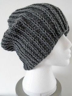 a gray knitted hat on top of a mannequin head