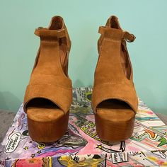 Color : Tan Suede Platform Wood Heel Style Name: Foxy-3 T-Strap Platform Heeled Sandals That Are Stacked With Character, With A Flirtatious Peep Toe Easy To Walk In Fun To Dress Up Or Wear With Jeans & A T-Shirt Never Worn They Come In The Original With Box I Will Gladly Answer Any Questions And Share More Pictures As Always ... Thank You For Shopping My Closet!! Comes From A Smoke Free Home Brown Suede Wedge Sandals With Ankle Strap, Brown Suede Sandals With Wrapped Heel, Brown Suede Ankle Strap Sandals, Brown Suede Open Heel Wedge Sandals, Brown Suede Heels With Heel Loop, Brown Suede Open Toe Heels, Brown Suede Open Heel Heels, Nude Platform Heels, Oxford Platform Shoes