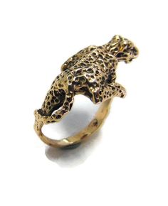 Leopard / Jaguar Yellow Gold Ring. Available in sizes 6 to 9. If another size is desired, please send us a message for a price quote. sized HAVE BEEN IN THE JEWELRY BUSINESS FOR MORE THAN 30 YEARS. PLEASE JUDGE BY THE PICTURES; IF ANY QUESTIONS FEEL FREE TO ASK! Yellow Gold Hallmarked Brass Rings, Hallmarked Yellow Gold Brass Rings, Hallmarked Yellow Gold Rings In Brass, Unique 14k Yellow Gold Ring, Unique 14k Gold Hallmarked Rings, Bronze 14k Gold Ring, 14k Gold Bronze Ring Jewelry, Unique 14k Yellow Gold Signet Ring, Unique Gold Cluster Ring