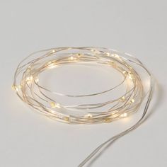 the white string lights are on top of each other