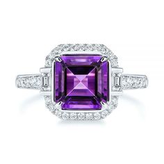 106049 14k White Gold Ring   Amethyst - 1.90 ctw   Octagon   32 Diamonds - .29 ctw   Clarity: SI, Color: H-I. This beautiful fashion ring features a 1.9 ctw amethyst, along with 32 diamonds. This ring is designed in 14k white gold. Rose gold and yellow gold are available for special order.          Asscher Cut in Halo Setting      Asscher cuts come square in shape with layered facets and clipped corners creating an octagonal shape. The signature appeal of this specific cut is a result of the bri Luxury Amethyst Ring With Brilliant Cut Diamond, Luxury Amethyst Diamond Ring With Brilliant Cut, Luxury Purple Gemstones With Halo Setting, Luxury White Gold Amethyst Ring With Diamond, Luxury Amethyst Ring With Emerald Cut Diamond, Luxury Brilliant Cut Amethyst Ring In White Gold, Luxury White Gold Amethyst Ring With Brilliant Cut, Luxury Emerald Cut Amethyst Ring With Diamond Setting, Luxury Emerald-cut Diamond Amethyst Ring