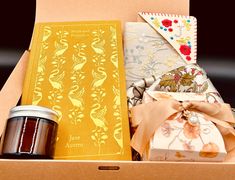 an open box with coffee, tea and other items