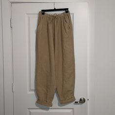 These Pants Are Super Lounge-Y, Comfy Pants That Are An Oversized Baggy Look. They Are Brand New, I Overestimated Sizing And Should Have Sized Down So I’m Reselling! Oversized Beige Pants With Pockets, Baggy Beige Bottoms For Loungewear, Comfortable Beige Bottoms With Relaxed Fit, Comfortable Relaxed Fit Beige Bottoms, Casual Beige Parachute Pants For Loungewear, Baggy Ankle-length Cargo Pants For Loungewear, Beige Wide Leg Relaxed Fit Sweatpants, Beige Wide-leg Relaxed Fit Sweatpants, Beige Relaxed Fit Harem Pants For Fall