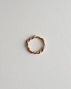 Hand twisted thick gold or silver band, available in two thicknesses. - made in 14k gold fill or sterling silver - hand twisted & detailed - available in 1.5mm or 3.5mm thicknesses - available full sizes **please allow for slight variations as each ring is hand twisted & made in our studio. Minimalist Twisted Gold Rings, Gold Spiral Stackable Rings, Gold Twisted Promise Ring, Everyday Jewelry With Modern Twisted Style, Minimalist Twisted Yellow Gold Jewelry, Everyday Twisted Modern Jewelry, Yellow Gold Twisted Stackable Jewelry, Adjustable Twisted 14k Gold Rings, Adjustable 14k Gold Twisted Ring