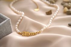 "18K Gold Old English Pearl Name Necklace - Gold Stainless Steel This is a Customized Necklace, shipment timings can vary. It will take 2 business weeks for processing! ----------------------------------------------------------------- *ANTITARNISH *WATERPROOF *HYPOALLERGENIC *%100 Lead & Nickel FREE ------------------------------------------------------------------- Old English Name Material: 18K Gold Plated Stainless Steel ------------------------------------------------------------------- Classic Letter Beads Jewelry As Gift, Classic Letter Beads Jewelry Gift, Hypoallergenic White Necklace For Personalized Gift, Classic Hypoallergenic Necklace For Gift, Classic Hypoallergenic Necklaces For Gifts, Elegant Letter Beads Necklace For Personalized Gift, Elegant Necklace With Letter Beads For Personalized Gift, Elegant Jewelry With Letter Beads For Gift, Dainty Necklace With Letter Beads As Gift