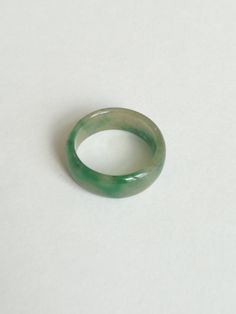 Sweet Green Jadeite Ring, Dainty Handcrafted Jade, Perfectly Polished Jadeite, Gift for Father This saddle jadeite ring features contemporary craftsmanship is made from natural untreated Burmese jadeite. It is polished for a high shine. Dimension (in this picture): Inner diameter: 19.10 mm Thickness: 2.52 mm Width: 7.55 mm Weight: 17.42 carat Ring Size: US 9.0 Everything is handcrafted with exceptional care in Hong Kong. Item is wrapped in beautiful box! Styling & Care: - Avoid direct contac Green Crystal Round Promise Ring, Green Round Crystal Promise Ring, Handmade Green Crystal Ring, Green Crystal Round Ring For Gift, Green Crystal Round Ring Gift, Green Crystal Round Ring As Gift, Green Crystal Ring Gift, Green Crystal Round Band Ring As Gift, Green Engraved Ring For Anniversary