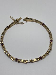 A Gorgeous Elegant Vintage 18Ct Gold Plated & Garnet Cubic Zirconia Tennis Bracelet  Size 7.5" Long Box Clasp & Two Safety Hooks Presented in good condition Vintage Gold Plated Bracelets, Bracelet Tennis, Box Clasp, Tennis Bracelet, Chain Link Bracelet, Bracelet Sizes, Link Bracelets, Chain Link, Garnet