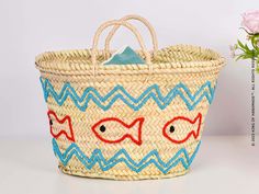 Perfect for Beach Vacations and Poolside Relaxation Make a splash this summer with our Embroidered Fish Motif Summer Bag. This unique beach tote is not only practical but also a fashion statement. The bag features a charming embroidered fish motif, adding a touch of whimsy to your beach or poolside look.The bag is spacious enough to hold all your summer essentials, from sunscreen to your favorite summer read. It's made from durable materials, ensuring it can withstand the rigors of summer advent Casual Embroidered Beach Bag For Vacation, Embroidered Rectangular Straw Bag For Beach, Embroidered Beach Straw Tote Bag, Embroidered Natural Beach Bag For Vacation, Embroidered Straw Tote Bag For Beach, Casual Embroidered Beach Bag For Summer, Embroidered Bags For Summer Vacation, Embroidered Beach Bag For Travel, Embroidered Bucket Bag For Beach