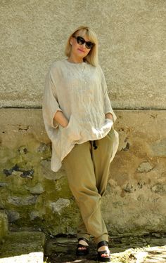 "Linen Tunic Shirt, Women Linen Shirt, Linen Clothing ☆ New collection! Beige 100% LINEN top! Casual linen tunic. Handmade loose shirt. Beige ORGANIC oversize Tunic,Top,Blouse Excellent style for spring and summer! This loose and comfy stylish Kaftan is adding elegant and fashion touch in your everyday life. Perfect solution for your everyday outfit. Be creative and different! ◾Quality NATURAL linen fabric. ◾Fabric: 100% Linen ◾Care: Wash in plenty of cold (+25/+30oC) water Use diluted detergent Casual Tunic Blouse With Buttons, Oversized Khaki Tops With Buttons, Beige Linen Lagenlook Top, Beige Beach Tops With Pockets, Oversized Beige Buttoned Top, Beach Beige Tops With Pockets, Relaxed Fit Tunic Top In Lagenlook Style, Relaxed Fit Lagenlook Tunic Top, Linen Lagenlook Tops With Pockets