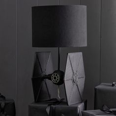 Join the Galactic Empire with our Star Wars TIE Fighter Table Lamp. Fit for the elite Imperial(TM) pilot, this lamp features the sleek design of the iconic starfighter. It's stylishly crafted with a hand-applied finish and topped with a patterned print inside of its linen shade. DETAILS YOU'LL APPRECIATE Expertly crafted from resin, iron and acrylic with a linen shade. Features a black, hand-painted finish. On/off switch. KEY PRODUCT POINTS 2 prong plug-in. Bulb (1): 60 watt, type A bulb (not in Star Wars Kids Room, Star Wars Tie Fighter, Star Wars Bedroom, Star Wars Tie, Star Wars Room, Star Wars Decor, Light The Way, Tie Fighter, Star Wars Kids