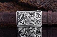 Mason Lynton Trophy Buckle - AXEL'S Hand Tooled Luxury Formal Jewelry, Luxury Hand Tooled Jewelry For Formal Occasions, Elegant Formal Hand-tooled Belt Buckles, Elegant Hand Tooled Belt Buckles For Formal Occasions, Elegant Hand Tooled Belt Buckles For Formal Wear, Classic Silver Hand-tooled Belt Buckle, Classic Hand Tooled Silver Belt Buckles, Luxury Formal Jewelry With Silver Buckle, Luxury Engraved Silver Belt Buckles