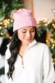 When it comes to this beanie, we are all about it! It's so warm and cozy with that cable knit fabric! The double pompoms are super cute too! This beanie is just so perfect for those cold, winter days and nights! Cozy Crochet Cable Knit Hat For Cold Weather, Cozy Cable Knit Crochet Hat For Cold Weather, Cozy Cable Knit Crochet Hat For Winter, Cute Crochet Winter Hat, Cozy Cable Knit Beanie For Cold Weather, Fall Beanie With Pom Poms For Cold Weather, Pink Beanie For Cold Weather, Cozy Pink Beanie For Cold Weather, Cold Weather Hats With Pom Poms