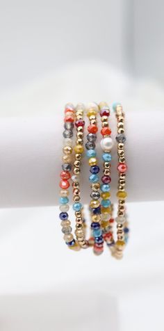 The Gold Multi Stone Bead Bracelet Set is a vibrant collection of bracelets adorned with an array of colorful stone beads, each accented with elegant gold touches. This set offers a versatile and eye-catching accessory option, perfect for adding a splash of color and sophistication to any outfit. Size: 6” - Inner Diameter Closure: Elastic Material: Zinc, Brass and Steel with Rhodium Plating Lead and Cadmium Safe - It is not Nickel Free Adjustable Multicolor Jewelry With Gold Beads, Multicolor Spacer Beads Wrap Bangle Bracelet, Multicolor Spacer Bead Wrap Bangle Bracelet, Multicolor Spacer Beads Wrap Bracelet, Multicolor Beaded Wrap Bracelet, Bohemian Multicolor Friendship Bracelets With Gold Beads, Multicolor Faceted Beaded Bangle Bracelet, Multicolor Stretch Bracelet With Gold Beads As Gift, Multicolor Faceted Beads Bracelets For Jewelry Making