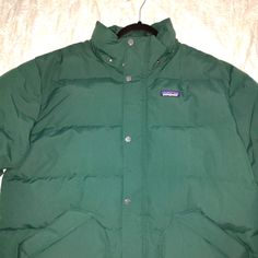 I Purchased This Jacket For A 13-Day Work Trip To Madison, Wisconsin. On The Day I Arrived, 01/14/24, The Wind Chill Was Minus 28 Degrees, And The Coat Kept Me Completely Warm. Unlike Most "Puffy Coats," This One Is Not Shiny. It Has A Matte Finish, And The Dark Green Color Is Beautiful. Reasonable Offers Will Be Considered, Please Don't Offer Half, Or More Than Half Of My Asking Price. Product Info Is As Follows: Fit And Design: Regular Fit Removable, Insulated Hood With Hidden Adjustment Cords Functional Green Puffer Jacket With Long Sleeves, Functional Green Long Sleeve Puffer Jacket, Green Long Sleeve Puffer Jacket For Outdoor, Patagonia Long Sleeve Puffer Jacket For Outdoor, Green Puffer Jacket For Hiking, Casual Green Puffer Jacket With Fleece Lining, Green Long Sleeve Puffer Jacket For Hiking, Patagonia Fall Puffer Outerwear, Patagonia Puffer Outerwear For Fall