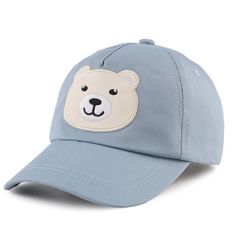 a blue hat with a white bear patch on the front and side of it's face