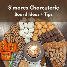 an assortment of snacks on a wooden platter with the words s'mores charcuterie board ideas and tips