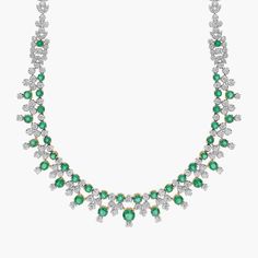 Set in 18k white and yellow gold, this incredible necklace features beautiful round emeralds and sparkling brilliant diamonds.  The perfect piece for your next big night out. Green Luxury Diamond Necklace For Anniversary, Luxury Green Diamond Necklace For Anniversary, Luxury Green Emerald Necklace With Diamond Accents, Luxury Green Diamond Necklace With Single Cut Diamonds, Luxury White Gold Round Emerald Necklace, Luxury Hand-set Round Emerald Necklace, Luxury White Gold Emerald Gemstone Necklace, Luxury White Gold Emerald Necklace With Round Pendant, Luxury Diamond Emerald Necklace, Fine Jewelry