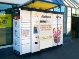 a row of vending machines sitting next to each other in front of a building