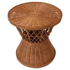 a wicker stool with an intricate design on the top