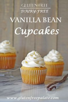 three vanilla bean cupcakes with white frosting