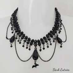 Necklace made with chain weaves and black crystals, with crystal drops and small bat-shaped element Gothic Necklace, Charm Necklaces, Crystal Drop, Black Crystals, Charm Necklace, Bat, Handmade Items, Weaving, Jewelry Necklaces