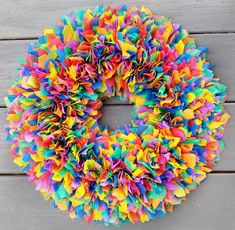 a multicolored wreath on a wooden surface