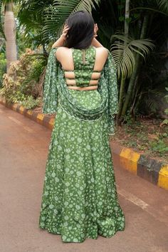 Olive green attached cancan lehenga with all over floral print. Paired with a padded blouse with matching print and hand embroidered with pearls, mirrors and glass beads and dupatta with matching print and sequin embroidered scallop border. - Aza Fashions Green Palazzo Set With Unstitched Blouse For Wedding, Green Palazzo Set With Unstitched Blouse For Reception, Green Palazzo Set With Unstitched Blouse For Festivals, Green Cutdana Pre-draped Saree Floor-length, Green Pre-draped Saree With Unstitched Blouse, Green Lehenga With Tilla For Reception, Green Floor-length Pre-draped Saree With Cutdana, Green Floor-length Pre-draped Saree With Unstitched Blouse, Green Sharara With Tilla And Traditional Drape