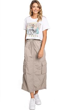 Chic, parachute skirt with an elastic waistband, a drawstring cinch tie and cargo pockets down the sides. Pair it with a graphic tee and sneakers for an effortless streetwear look. CARE | Machine Wash Cold CONTENTS | 100% Nylon MEASUREMENTS | 33"/85 cm Top to Bottom (Size Small) MODEL | 5'8 - wearing a size Small IMPORTED Spring Cargo Skirt With Pockets For Streetwear, Spring Streetwear Cargo Skirt With Pockets, Summer Utility Cargo Skirt With Drawstring, Summer Streetwear Cargo Skirt, Casual Cargo Skirt With Drawstring For Summer, Casual Drawstring Cargo Skirt For Summer, Summer Cargo Skirt With Pockets For Streetwear, Casual Summer Cargo Skirt With Drawstring, Casual Cotton Cargo Skirt For Summer